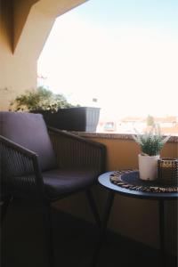 a chair and a table on a balcony at Apartman Hajdi in Zadar