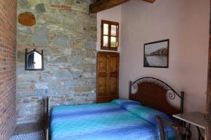 A bed or beds in a room at Molino in chianti