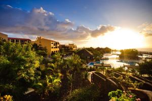 a view of a city with the sun setting at Esencia de La Palma by Princess - Adults Only in Fuencaliente de la Palma