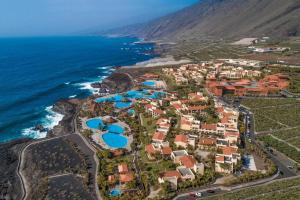 an aerial view of a resort next to the ocean at Esencia de La Palma by Princess - Adults Only in Fuencaliente de la Palma +74 photos