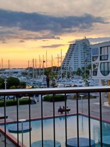 a view of a marina from the balcony of a hotel at Fenestrelle By LGM 57m2 clim, wifi, ménage inclus in La Grande Motte