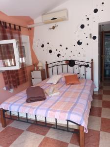 a bedroom with a bed and a wall with planets at Apartment Mirjana I in Šišan
