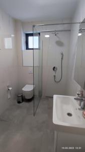 Koupelna v ubytování Apartments LORA in Bonila