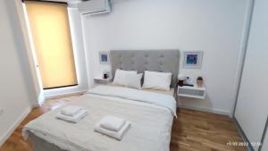 Postel nebo postele na pokoji v ubytování Apartments LORA in Bonila