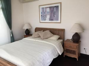 Ένα ή περισσότερα κρεβάτια σε δωμάτιο στο Driftwood Villa +16 φωτογραφίες