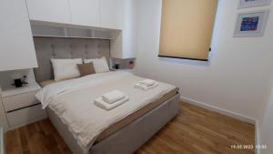 Postel nebo postele na pokoji v ubytování Apartments LORA in Bonila