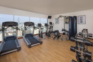 a gym with treadmills and exercise equipment in a building at Radisson Hotel Colombo in Colombo
