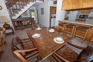 a wooden table and chairs in a kitchen at 3336 Pine Hill Road home in South Lake Tahoe