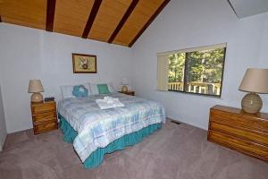 a bedroom with a bed and a window at 3336 Pine Hill Road home in South Lake Tahoe +11 photos
