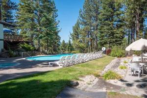 a group of chairs and a swimming pool at 3336 Pine Hill Road home in South Lake Tahoe