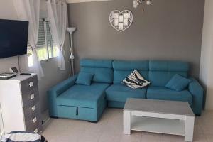 Posedenie v ubytovaní Apartamento con terraza a pie de playa