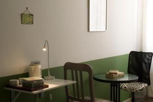 a room with a table and a small table with a chair at Al Sesto B&B in Salerno