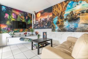 a living room with a large mural on the wall at Richmond Private Rooms - 151 Hoddle Homestay in Melbourne