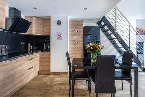 a kitchen and dining room with a table and chairs at JEAN MÉDECIN - Modern Flat - Heart of center in Nice +8 photos