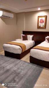 Voodi või voodid majutusasutuse يان للشقق المخدومة - Yan Apartments toas