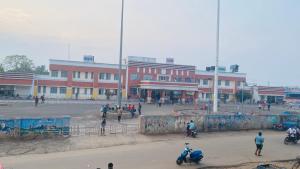 a group of people in front of a building at Dusilu Homestay in Bhadrak