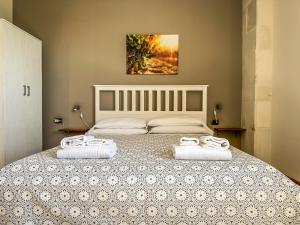 Postel nebo postele na pokoji v ubytování B&B Il Leccio