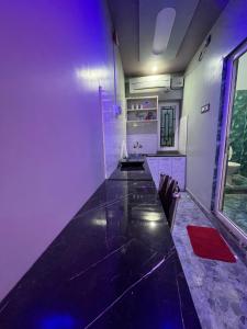 a room with a long table in a room at Dusilu Homestay in Bhadrak