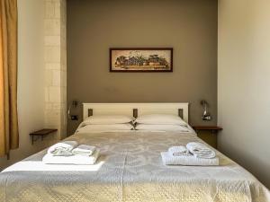 Postel nebo postele na pokoji v ubytování B&B Il Leccio