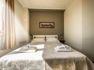 Postel nebo postele na pokoji v ubytování B&B Il Leccio