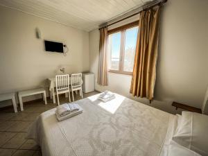 Postel nebo postele na pokoji v ubytování B&B Il Leccio