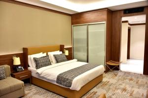 Postel nebo postele na pokoji v ubytování فندق رويال فيستا Royal Vista Hotel