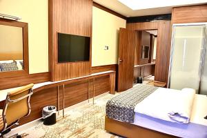 Postel nebo postele na pokoji v ubytování فندق رويال فيستا Royal Vista Hotel
