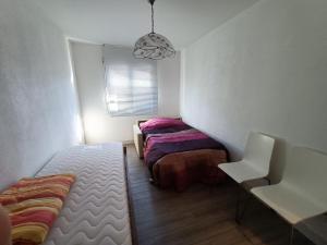 A bed or beds in a room at Fornace 2 Vacallo
