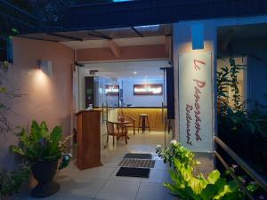 a patio with a table and a dining room at Bohol Vantage Resort in Panglao