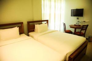 Postel nebo postele na pokoji v ubytování Sobaya Hotel