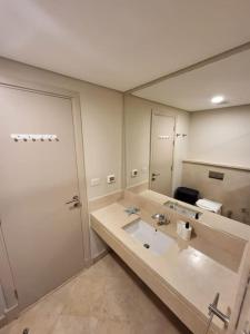 A bathroom at Mangroovy - 2BR La Blanca Pool View