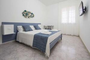 Voodi või voodid majutusasutuse La Paranza Apartments Lampedusa toas