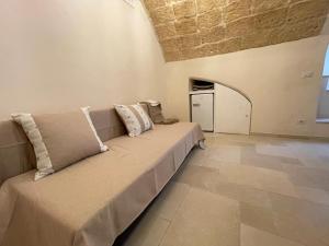 A bed or beds in a room at La Piccola Sanremo - ROOM & COFFEE -