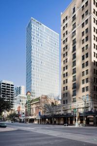 two tall buildings in a city with a street at Hyatt Centric Congress Avenue Austin in Austin