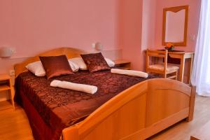 Кровать или кровати в номере Hotel Art