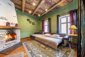 a bedroom with a bed and a fireplace at Old Town - Dunkri Apartment in Tallinn