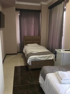 Voodi või voodid majutusasutuse RP HOTEL (NEW) toas