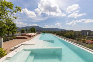 a swimming pool on the roof of a building at Laguna Skypark by My Home Phuket in Bang Tao Beach