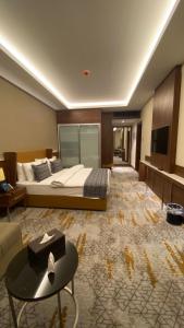 Postel nebo postele na pokoji v ubytování فندق رويال فيستا Royal Vista Hotel