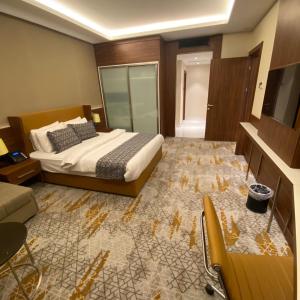 Postel nebo postele na pokoji v ubytování فندق رويال فيستا Royal Vista Hotel