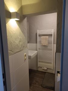 a small bathroom with a sink and a toilet at Gästehaus Ferienglück Grainau in Grainau