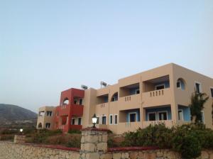 a building on top of a stone wall at Archipelagos Apartments in Arkasa