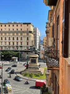 a view of a city with a statue in the middle of a street at Kore Luxury Suite e Spa in Naples