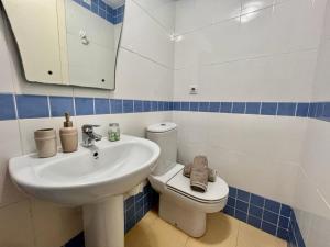 a bathroom with a sink and a toilet at Casa Pepa by Sun & Sea Homes in Moraira