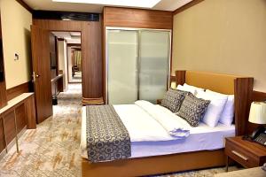 Postel nebo postele na pokoji v ubytování فندق رويال فيستا Royal Vista Hotel