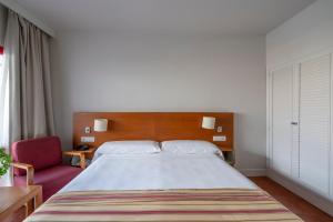 Кровать или кровати в номере Parador de Nerja