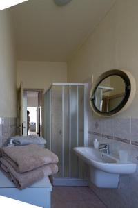 a bathroom with a sink and a mirror at Casa Margherita Bellagio in Bellagio