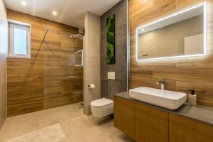 a bathroom with a sink and a toilet at Villa Argola in Split +86 photos