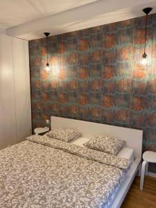 Ένα ή περισσότερα κρεβάτια σε δωμάτιο στο Liberty Deluxe Apartment Cosmopolis