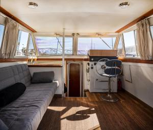 a living room of a boat with a couch at Spacious and charming BOAT in Port Forum in Barcelona
